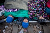 24 November 2015, Idomeni, Greek - FYROM Border, Greece Greece. Fresh humanitarian situation developing at border crossings from Greece to the Balkans. Three Iranians sleep on the rail tracks at the border line between Greece and FYROM, close to the Greek village of Idomeni. One of them has his mouth sewn in protest of the restrictions imposed against the movement of certain nationalities.